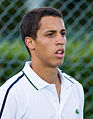 Tristan Lamasine competing in the first round of the 2015 Wimbledon Qualifying Tournament at the Bank of England Sports Grounds in Roehampton, England. The winners of three rounds of competition qualify for the main draw of Wimbledon the following week.