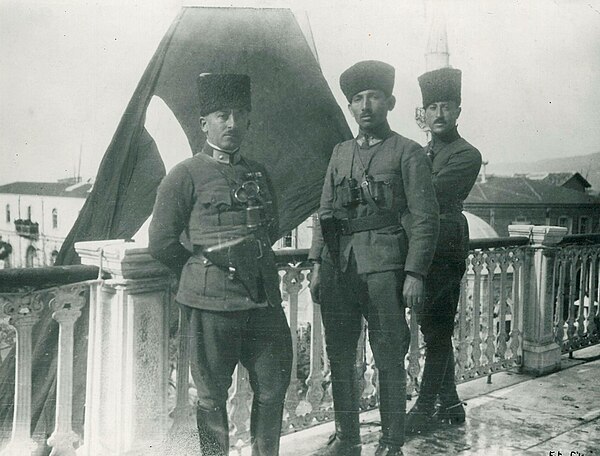 Turkish Cavalry Officers of the 4th Regiment, 2nd Cavalry Division with their Regimental Flag: Captain Şerafettin (İzmir), Lieutenant Hamdi (Yurteri) 