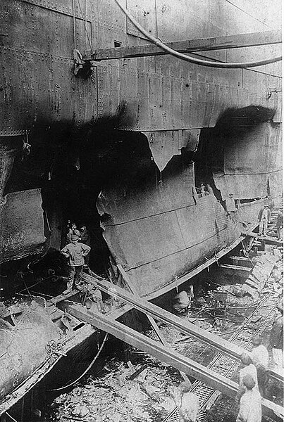 File:USS West Bridge, torpedo damage, starboard.jpg