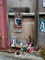 Shrine to the Virgin Mary affixed to the western wall of Cross Bones in Southwark.