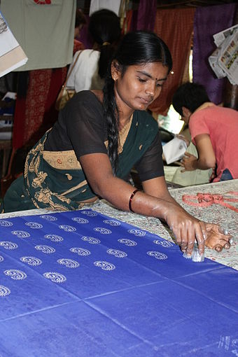 Woman doing block printing at Halasur village, Karnataka, India.