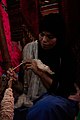 Woman weaving wool 2