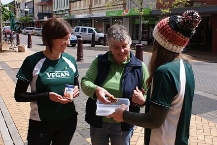 Vegans giving out soymilk alongside banana chocolate chip muffins on the street