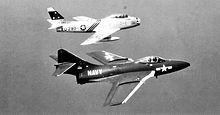 75th Fighter-Interceptor Squadron North American F-86A Sabre 49-1280 with a Navy Grumman F9F-6 Cougar over Long Island, 1952