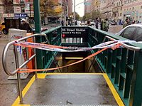 Southwest entrance, closed in preparation for Hurricane Sandy in 2012 86 SW IRT Bway Sandy.JPG