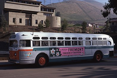 AC Transit #1811 purchased from Key System, repainted in "clownface" white and orange livery, featuring wing logo