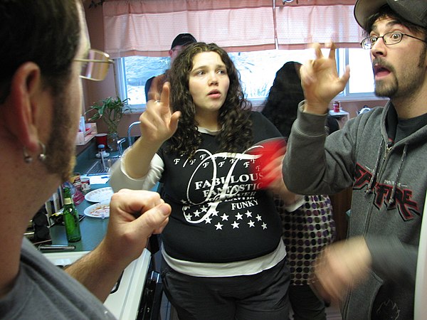 Two men and a woman signing American Sign Language (2008)