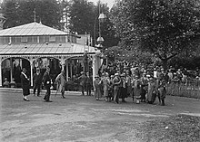 A gathering of people at the Rock Park Pump House, Llandrindod, 1920s