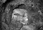 A miner hauling a car of silver radium ore, 340 feet below the surface, Eldorado Mine of Great Bear Lake.jpg