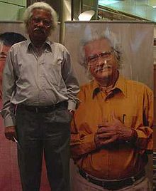 Gopalakrishnan standing next to his portrait Adoor gopalakrishnan.jpg