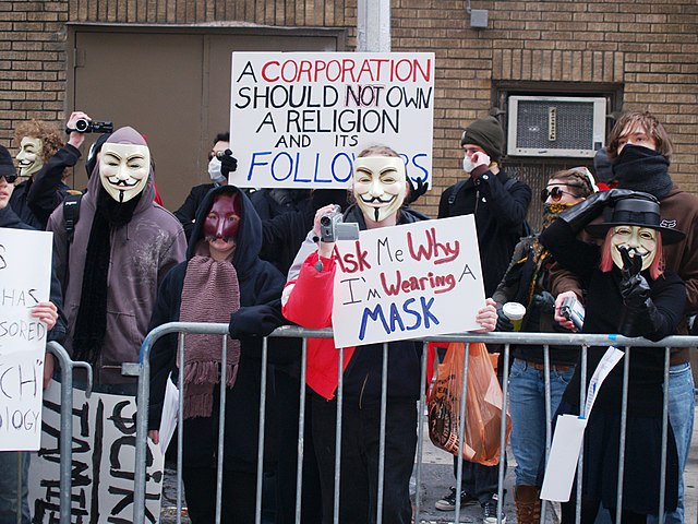Protesters outside a Scientology center on February 10, 2008, donning masks, scarves, hoods, and sunglasses to obscure their faces, and gloves and lon