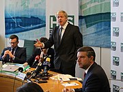 UK Prime Minister Boris Johnson speaking on Global Britain and foreign aid at the Henry Jackson Society on 11 February 2019. Boris Johnson speaking at Henry Jackson Society IPU Room Palace of Westminster 11 February 2019 - seated behind l-r James Rogers Bob Seely MP and Alan Mendoza.jpg