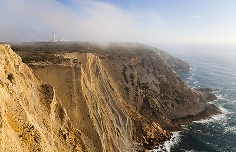Cape Espichel and its lighthouse in the fog, Portugal