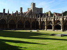 The cloister of Canterbury Cathedral with monastic buildings beyond Canterbury grass.jpg