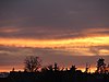 Cirrus mammatus mit Schattenstrahlen im Abendrot