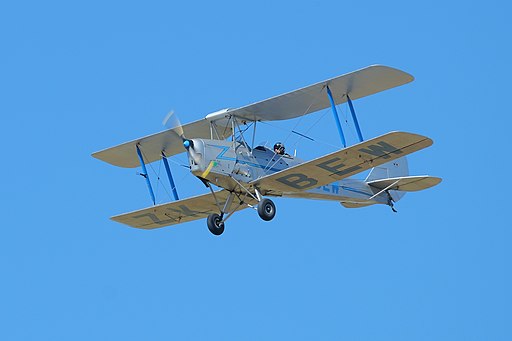 De Havilland DH-82A Tiger Moth 'ZK-BEW' flying in blue sky