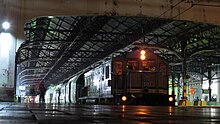 Eastern and Oriental Express hauled by KTM Class 25 locomotive, stopping at Kuala Lumpur station for crew change. E&OE test run KLO.jpg