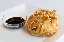 A fried dim sim (South Melbourne style) with soy sauce