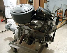 An oil bath air filter at the upper left in a GAZ-21 engine GAZ-21 engine restored right.jpg
