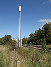 A GSM-R mast and cabinet Abergavenny, Wales, in 2011