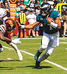 Hurts stiff arms a defender in 2022 Jalen Hurts 2022 Eagles (cropped).jpg