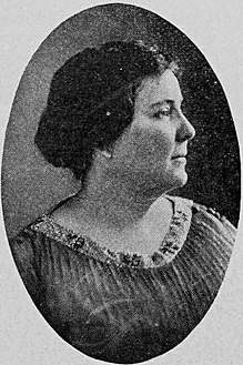 A middle-aged white woman's face and neck, almost in profile, in an oval frame.