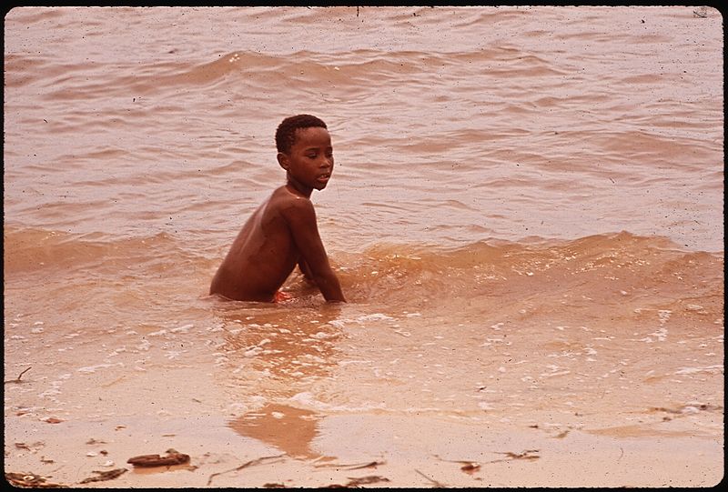 File:LAKE PONTCHARTRAIN HAS BEEN DECLARED POLLUTED - BUT IT DOES NOT DETER YOUNG SWIMMERS - NARA - 544196.jpg