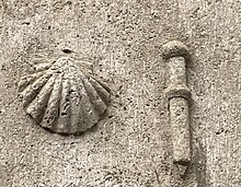 Scallop shell and pilgrim's staff on the Pilgrim's Lodge in Larchant Larchant scallop shell and pilgrim's staff.jpg