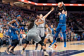 Lindsay Whalen (13) is guarded by Kelsey Plum (10) as she takes a shot in the Lynx vs Aces game.jpg