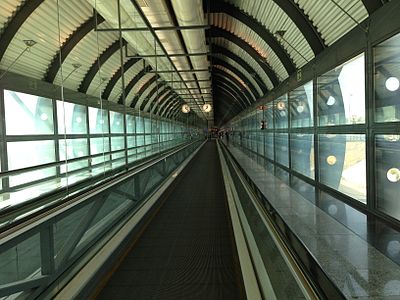 An internal motorized moving footway to transport passengers within Adolfo Suárez Madrid–Barajas Airport, Spain
