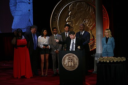 Mike Schur accepts the Peabody for Parks and Recreation. He is joined on stage by Retta, Jim O'Heir, Aubrey Plaza, Aziz Ansari, Adam Scott, Nick Offerman and Amy Poehler at the 71st Annual Peabody Awards.