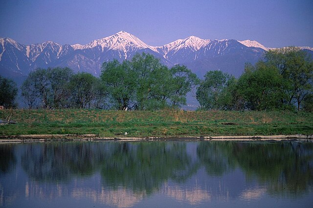 Mount Jōnen , Mount Yokotooshi and Azusa River in spring from Azumi Basin