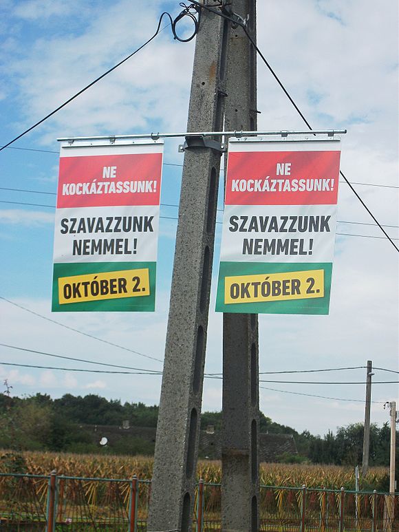 Posters of the government in Zichyujfalu. Subtitle: "Do not take chances!" (red background color) and ("Vote 'no'!") (white background color) Nepszavazasi plakatok, Zichyujfalu 7.jpg