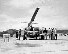 Journalists and news reported examine a Model 12, which was used to survey the area after a nuclear test in Nevada. April 21, 1952. NNSA-NSO-913.jpg