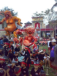 The last day of the year includes processions of Bhuta (demons, above), followed by Nyepi, the festival of silence. Ogoh-Ogoh---Ubud Football Field-Red one with kids.jpeg