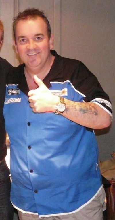 Phil Taylor (pictured in 2009) won his tenth world darts championship and eighth in a row with a 7–0 whitewash of Manley.