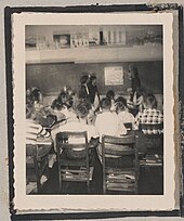 Photograph of a classroom full of students observing a poster on a chalkboard wall, Clarkesville, Habersham County, Georgia, 1950 Photograph of a classroom full of students observing a poster on a chalkboard wall, Clarkesville, Habersham County, Georgia, 1950 - DPLA - ba8ec93afeaf5eca394e0c8b9142af00-004.jpeg