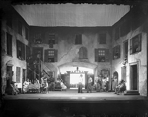 Throckmorton's set design for Catfish Row as it appeared in Porgy (1928). Seven years later, this iconic set design was re-used for George Gershwin's musical adaptation Porgy and Bess (1935).