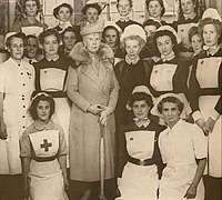 Queen Mary and Matron Saxby with the nursing staff (1948).[7]