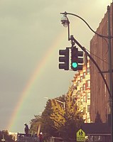 Rainbow over Malcolm X Boulevard, in a view looking northward from Central Park North
