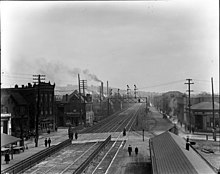 The Pennsylvania Railroad through Wilkinsburg in 1913 before being elevated. Rebecca Ave Crossing, 1913 (26961970641) (2).jpg