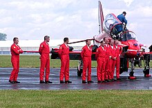 The pilots line up for an official photo after their display in June 2004 Red.arrows.pilots.arp.750pix.jpg