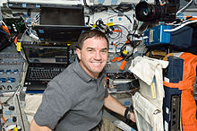 Walheim on the flight deck of Space Shuttle Atlantis during the STS-135 mission. STS-135 Rex Walheim on the flight deck.jpg