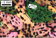 A thin section of sea ice seen through cross-polarized light. All crystals (they have different interference colors) contain inclusions of brine (saline solution) and air - these lie within the (0001) crystallographic plane. Sea ice microstructure.svg