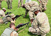 Soldiers of the U.S. Army 6th Squadron, 8th Cavalry Regiment, 2nd Infantry Brigade Combat Team, 3rd Infantry Division train Ukrainian Soldiers on trigger squeeze during a 2016 drill. Soldiers of 6th Squadron, 8th Cavalry Regiment, 2nd Infantry Brigade Combat Team, 3rd Infantry Division train Ukrainian Soldiers on trigger squeeze.jpg