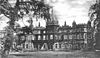 An old black and white photo of a stately country house.