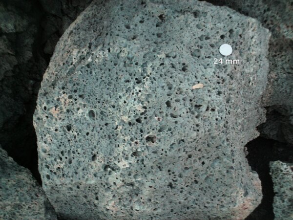 Vesicular basalt at Sunset Crater, Arizona. US quarter (24mm) for scale.