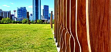 An art installation of wood slats used to outline the original fort and the height of its palisades. Watching the City Grow.jpg