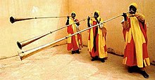 The Kakaki, also known as "Waza" or "Malakat" is a three- to four-meter-long metal trumpet used in African Hausa. Waza trumpeters.jpg