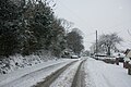 Ventnor Road, Whitwell, Isle of Wight looking north towards the High Street, shortly after heavy snowfall on the island during the night.